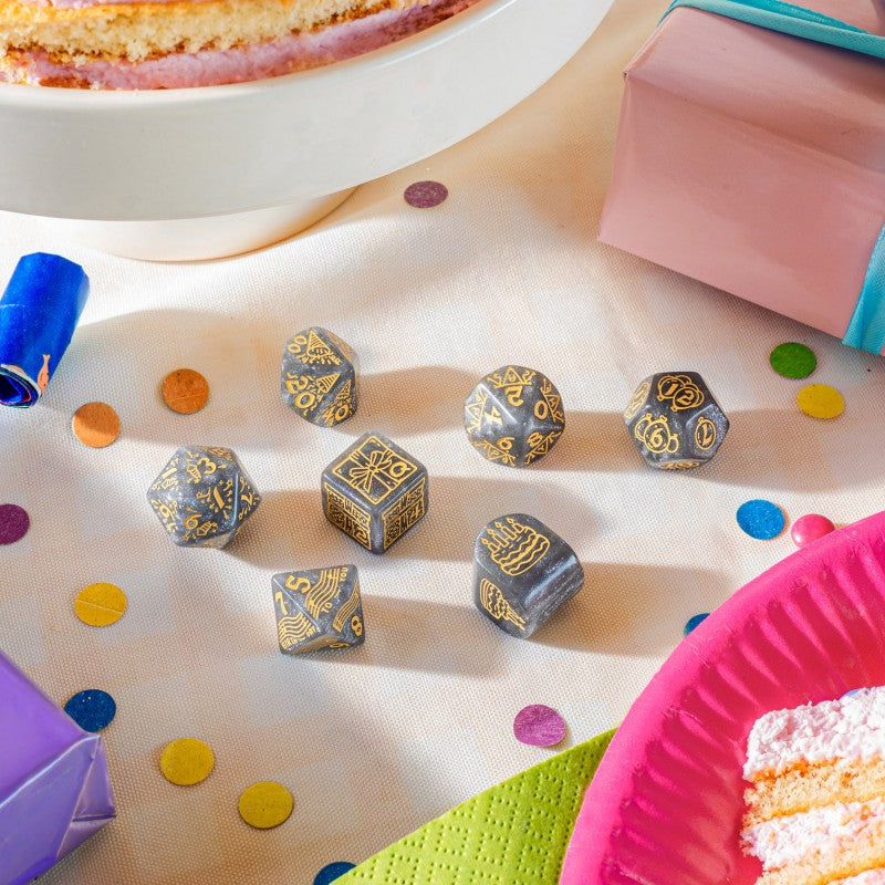 First view showing different dices of Q Workshop’s Happy Birthday D7 Dice Set Confetti sitting on table
