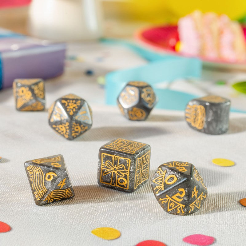 Second view showing different dices of Q Workshop’s Happy Birthday D7 Dice Set Confetti sitting on table