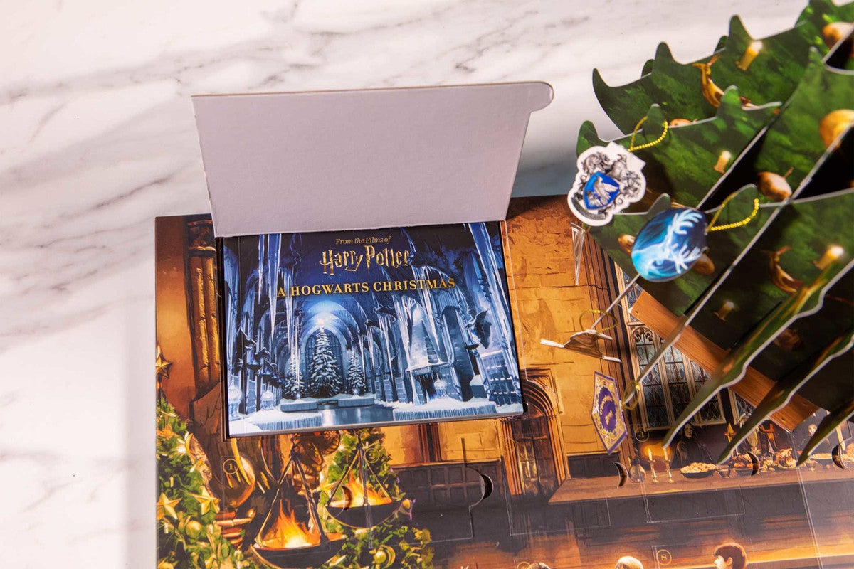 Open "Harry Potter: A Hogwarts Christmas" advent calendar, revealing a pop-up tree with House crest and Patronus ornaments