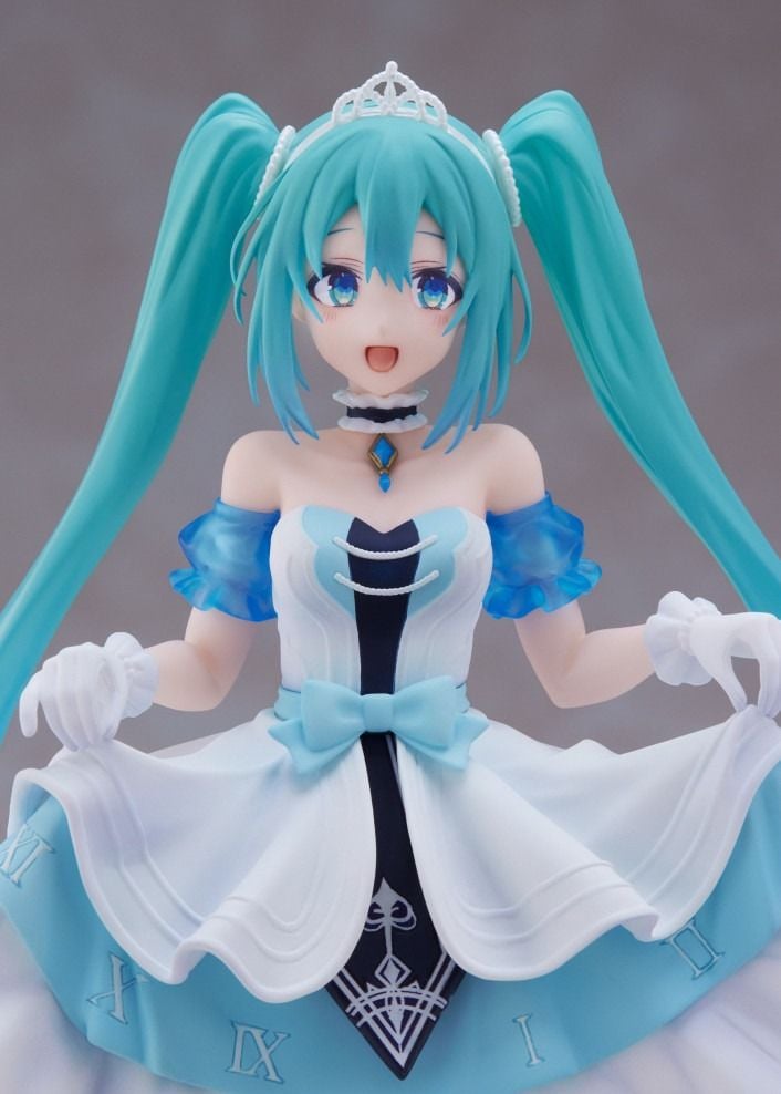 Hatsune Miku figure, turquoise twin tails, white and blue princess gown with a clock motif, tiara, and gloves