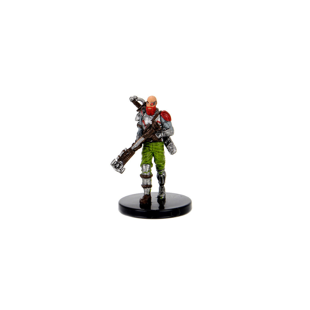 Painted miniature of a bald, red-bearded soldier in grey armor and green pants, carrying a large sci-fi rifle