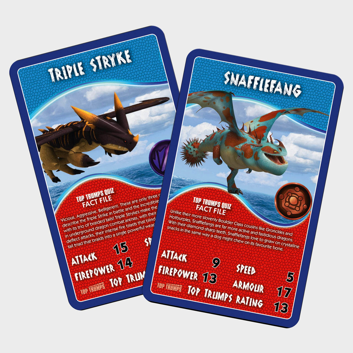Two Top Trumps dragon cards: one with a spiky brown Triple Stryke, the other with a blue and orange Snafflefang