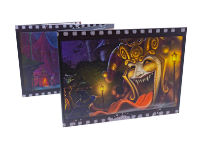 Two film-strip fantasy art panels. The front shows a terrifying jester mask with sharp teeth, a wizard, and a goblin in a dark carnival.