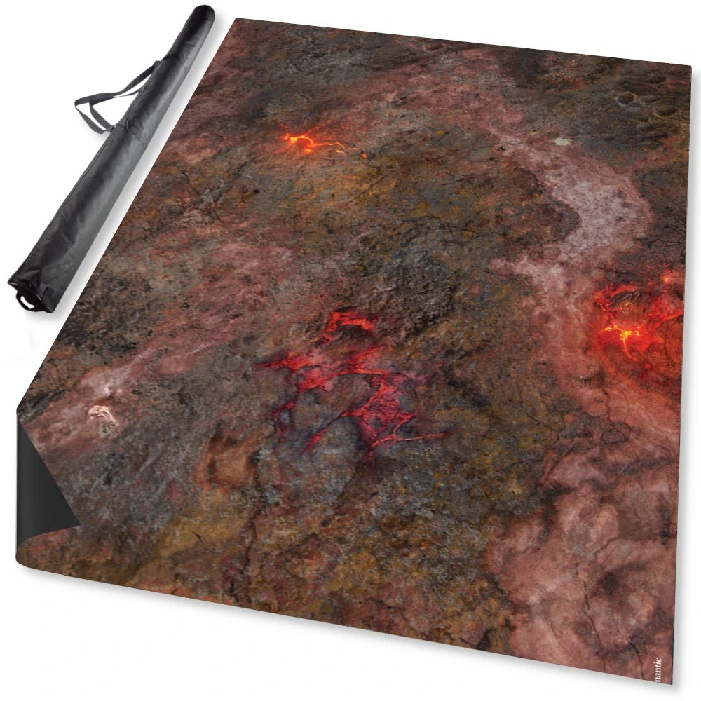 A volcanic gaming mat depicting molten lava and dark rocky terrain, with a black carrying case beside it