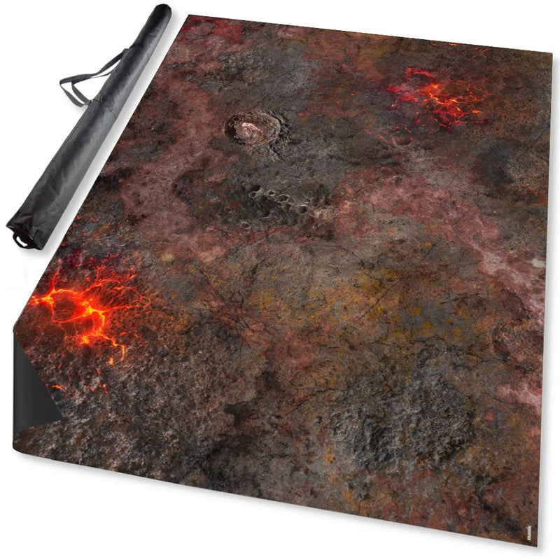 Volcanic gaming mat with glowing lava, rocky terrain, and a crater, next to a black carrying bag