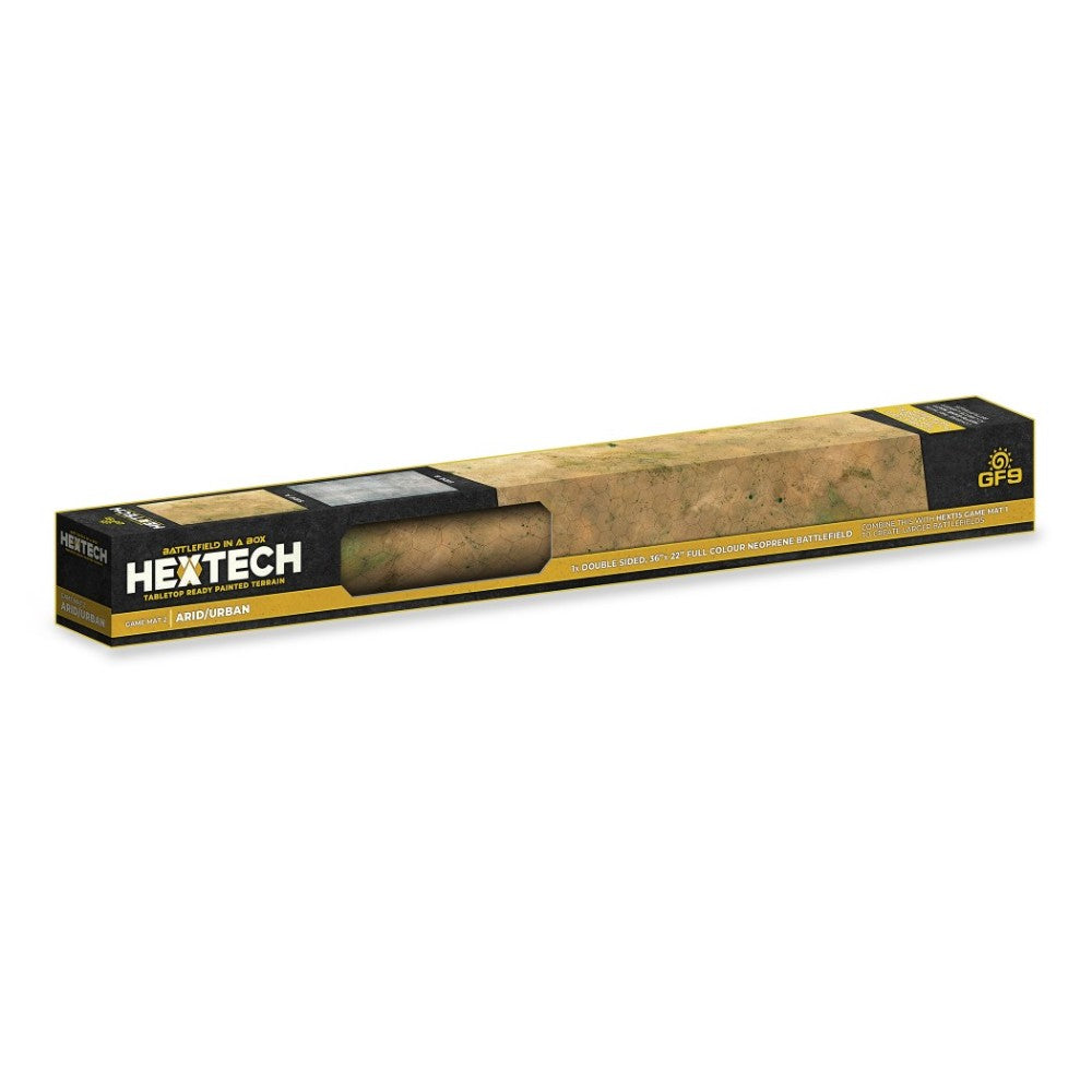 A long Hextech "Battlefield in a Box" product package showing a rolled Arid/Urban tabletop game mat