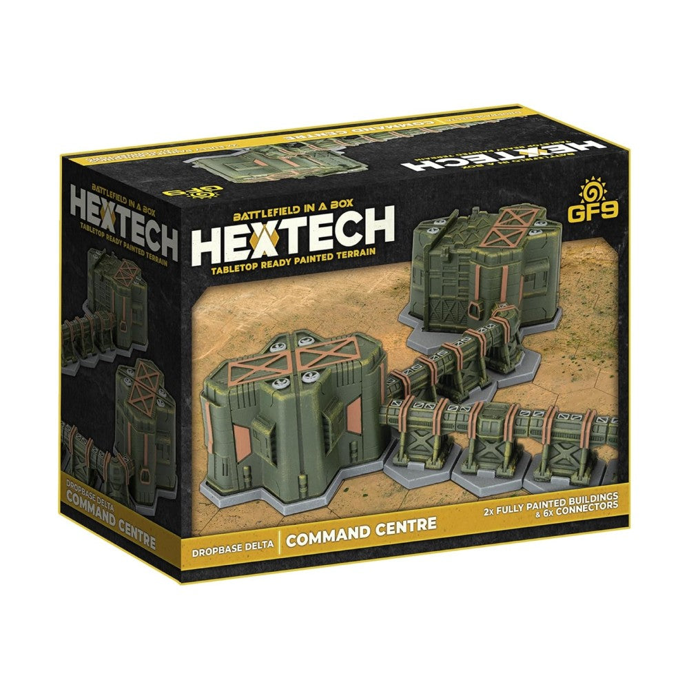 Product box for Hextech terrain set, showing two green futuristic buildings and six connectors on a sandy tabletop base.