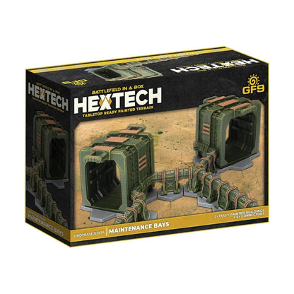 Hextech 'Dropbase Delta Maintenance Bays' product box. Displays two green sci-fi buildings linked by walkways on tabletop terrain.