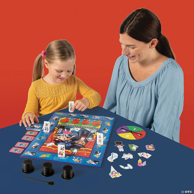Peaceable Kingdom Hoppin&#39; to the Show board game with child and adult playing