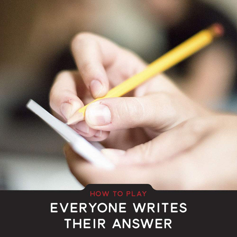 Close-up of a person&#39;s hands holding a small paper and writing with a yellow pencil