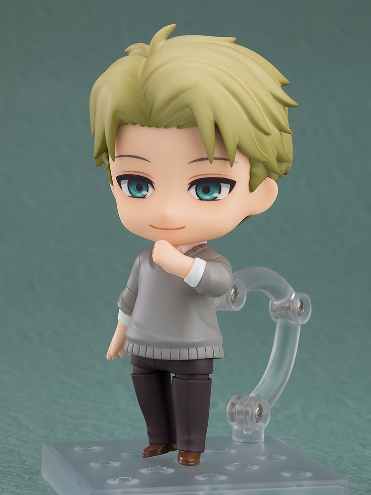 Blonde-haired Nendoroid figure of Loid Forger in a gray sweater, smiling with hand to chest