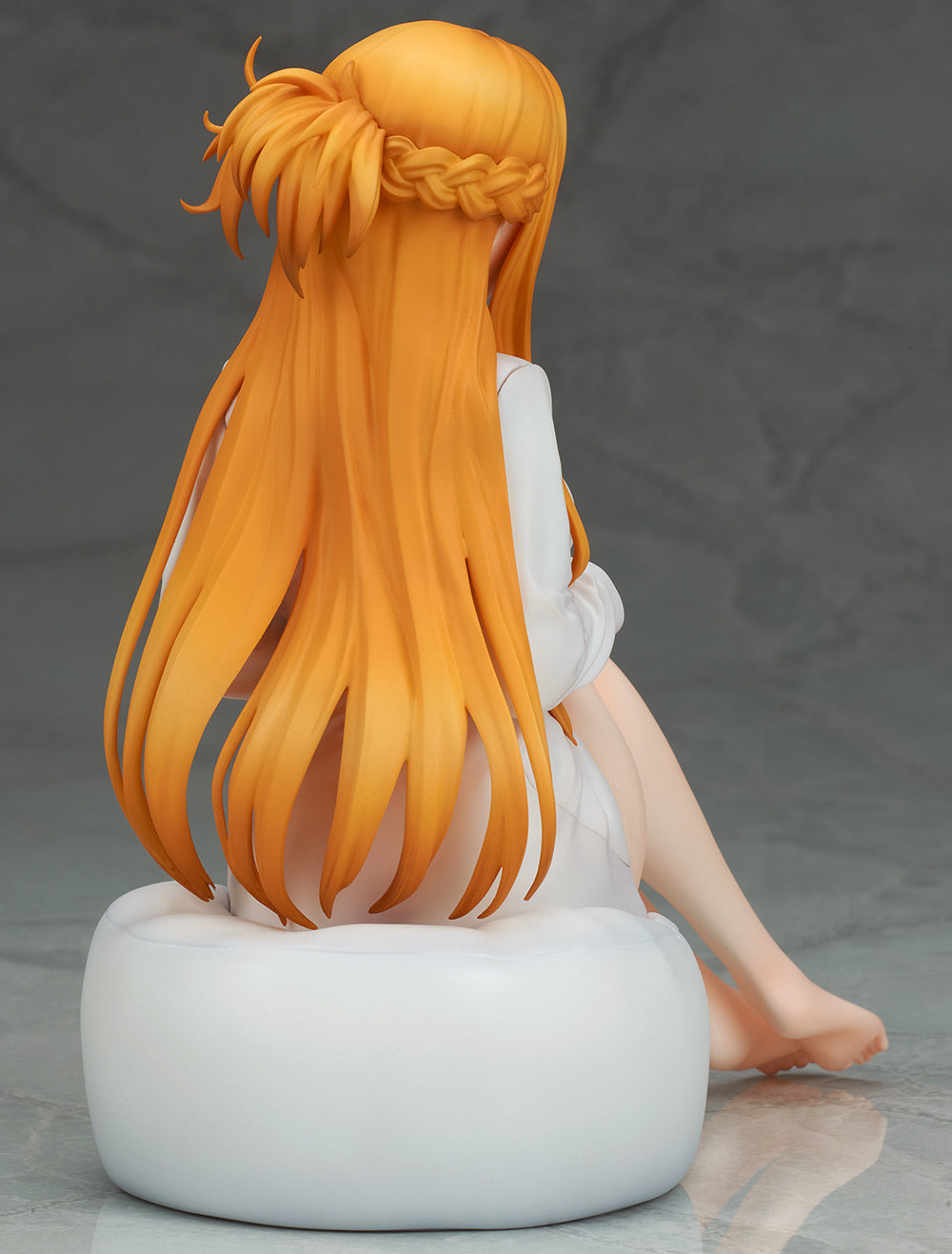 Rear angle displaying detailed hair strands and shirt drape across her back
