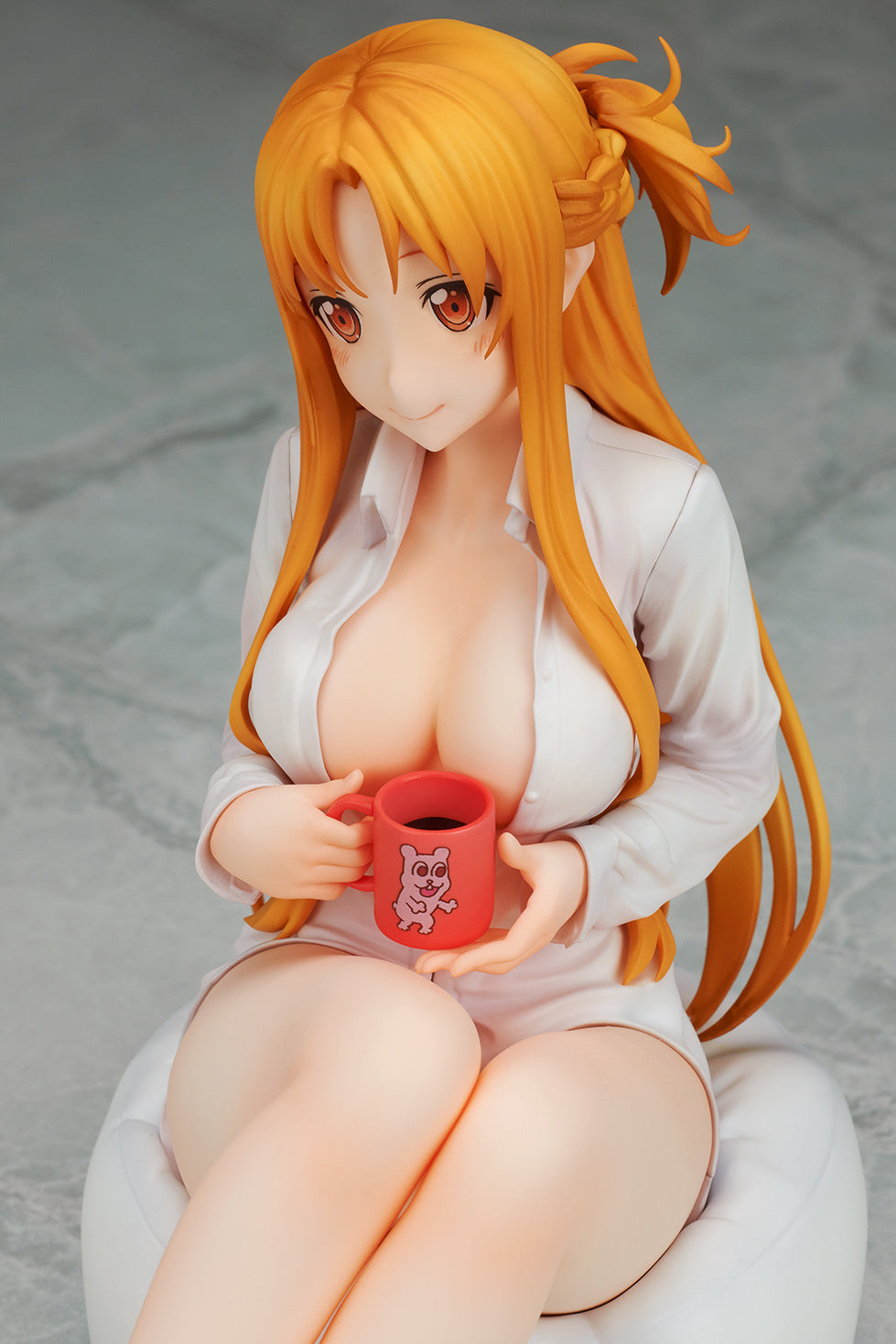 Overhead front angle showing her crossed legs and softly flowing hair