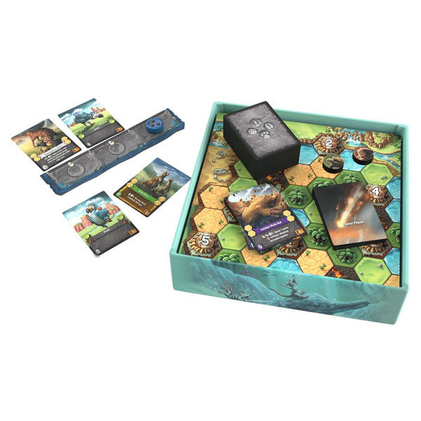 Comet board game components including board cards and game pieces displayed on a white surface
