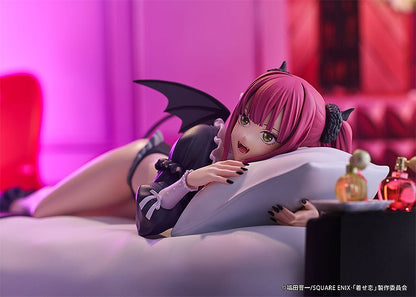 Anime figure of a pink-haired girl in a black devil outfit lounging on a pillow lying on her stomach