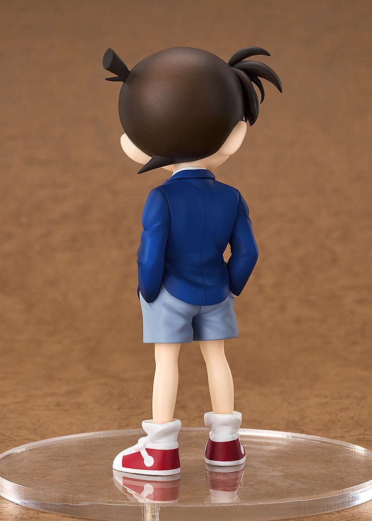 Good Smile Company Detective Conan Nendoroid Conan Edogawa Action Figure standing back view in blue jacket and gray shorts with red and white sneakers