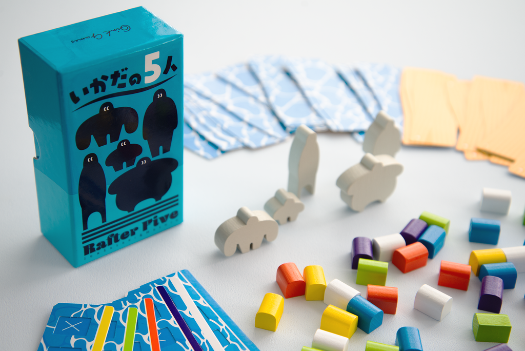 Oink Games Rafter Five balance puzzle with teal box wood animal pieces and colorful wooden blocks set on a light background