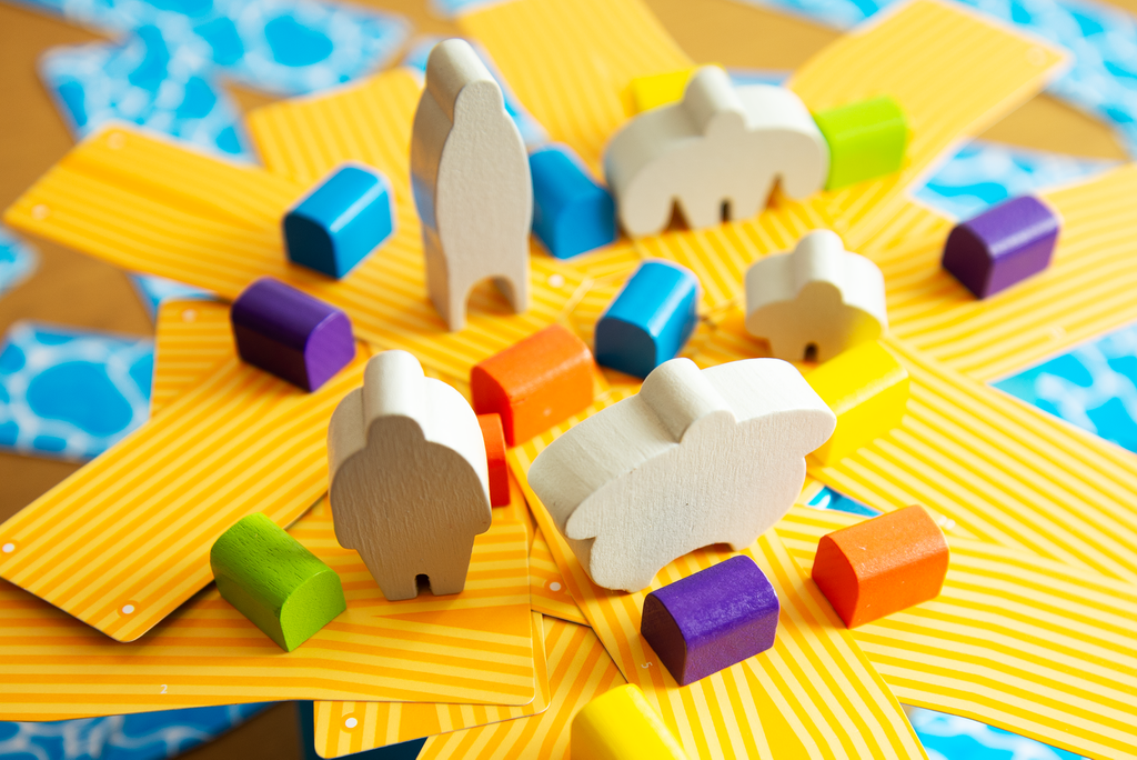 Oink Games Rafter Five balance puzzle featuring natural wood human and animal meeples plus colorful block pieces on striped yellow cards arranged like a fan