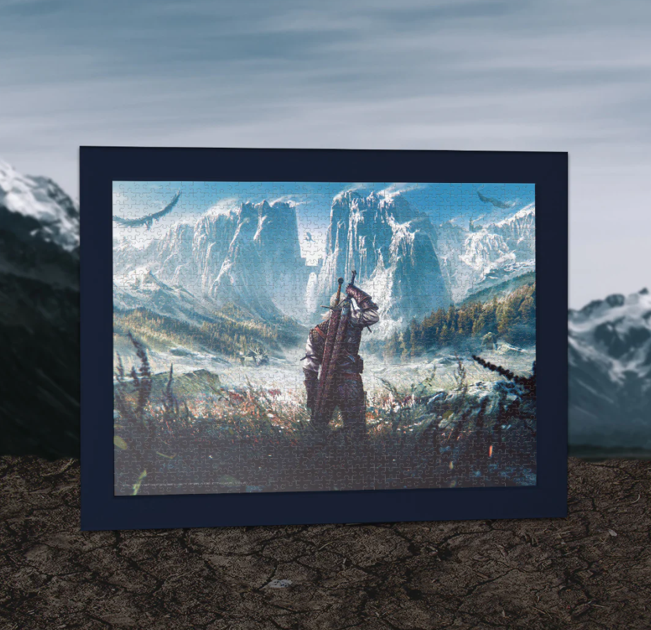 A framed jigsaw puzzle showing a warrior with a sword standing in a vast, snowy mountain landscape