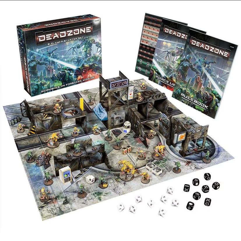 A Deadzone sci-fi board game setup with miniature figures, modular terrain, rulebooks, and dice