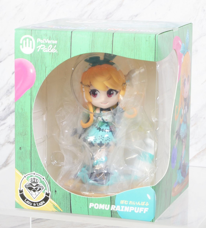 PalVerse Pale Pomu Rainpuff figure in a green wooden box with a clear window