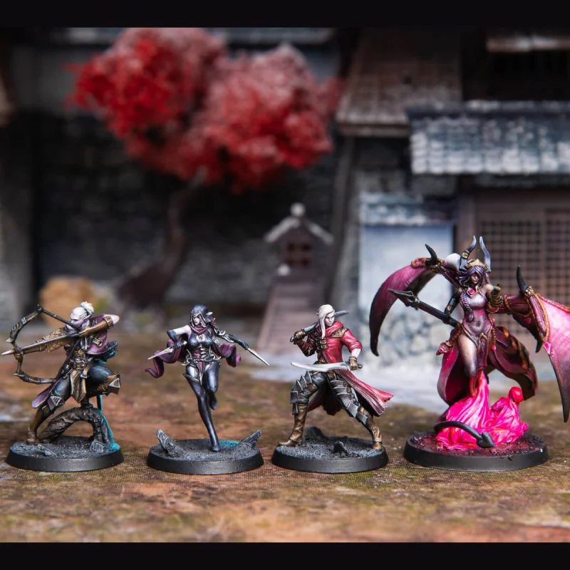 Four detailed painted fantasy miniatures: archer, sword-wielders, winged demon, on a tabletop with a Japanese backdrop