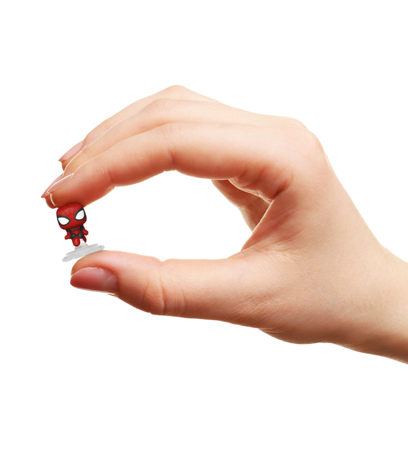 Hand holding a tiny chibi Spider-Man collectible figure on a white stand