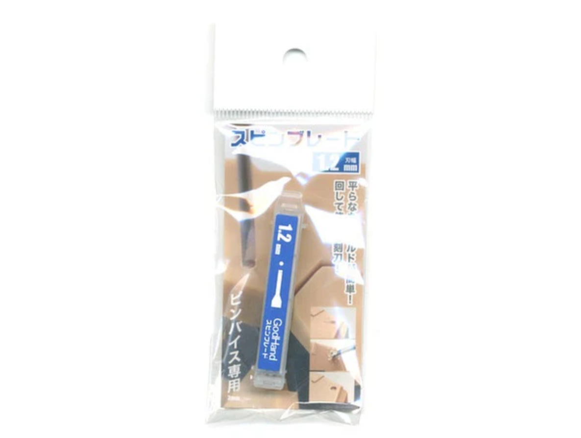 A packaged GodHand  1.2mm scribing blade for pin vises, used for model carving
