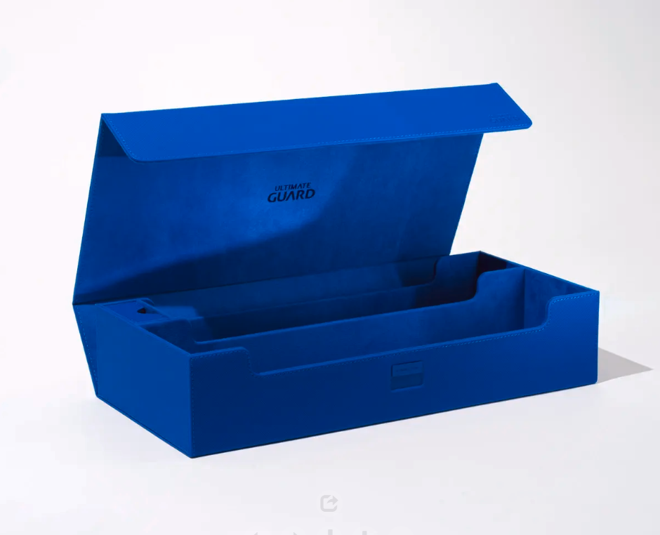 A vibrant blue card storage box by Ultimate Guard with its lid open, revealing multiple compartments