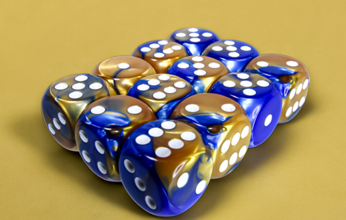 A cluster of blue and gold Gemini marbled dice with white pips