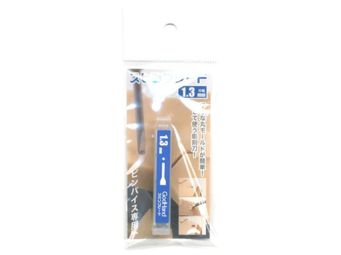 A 1.3mm GodHand  engraving blade in clear plastic packaging with Japanese text and usage examples