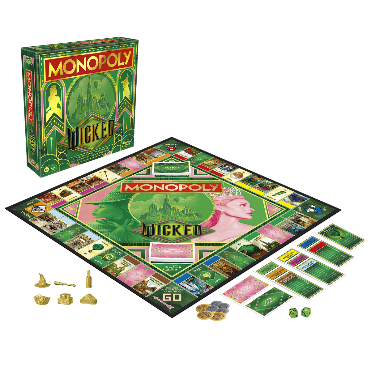 A Monopoly Wicked Edition game set, featuring a green box, board with Elphaba and Glinda art, gold tokens, cards, and dice laid out