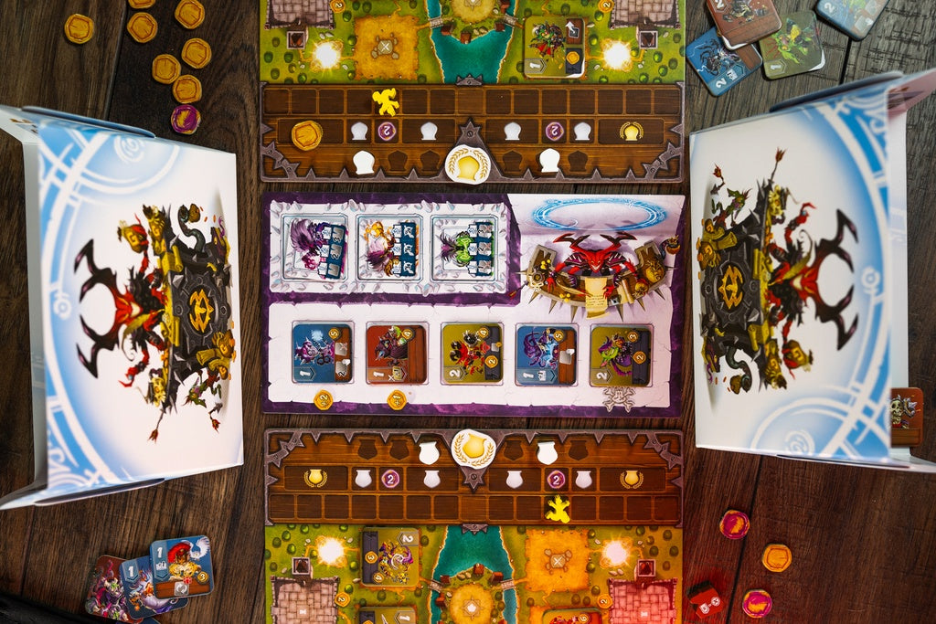 Overhead view of a fantasy-themed board game with game board tokens and open instruction books