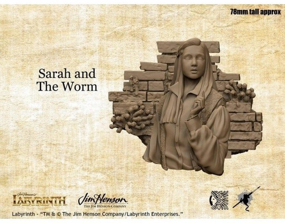 Unpainted Labyrinth Sarah bust model against a brick wall with distinct worm forms. Text: 'Sarah and The Worm'