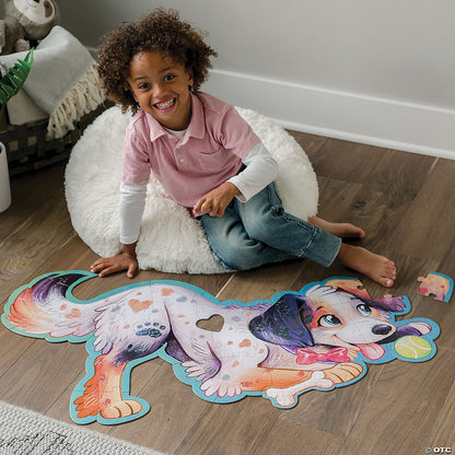 Child assembling Puppy puzzle on the floor