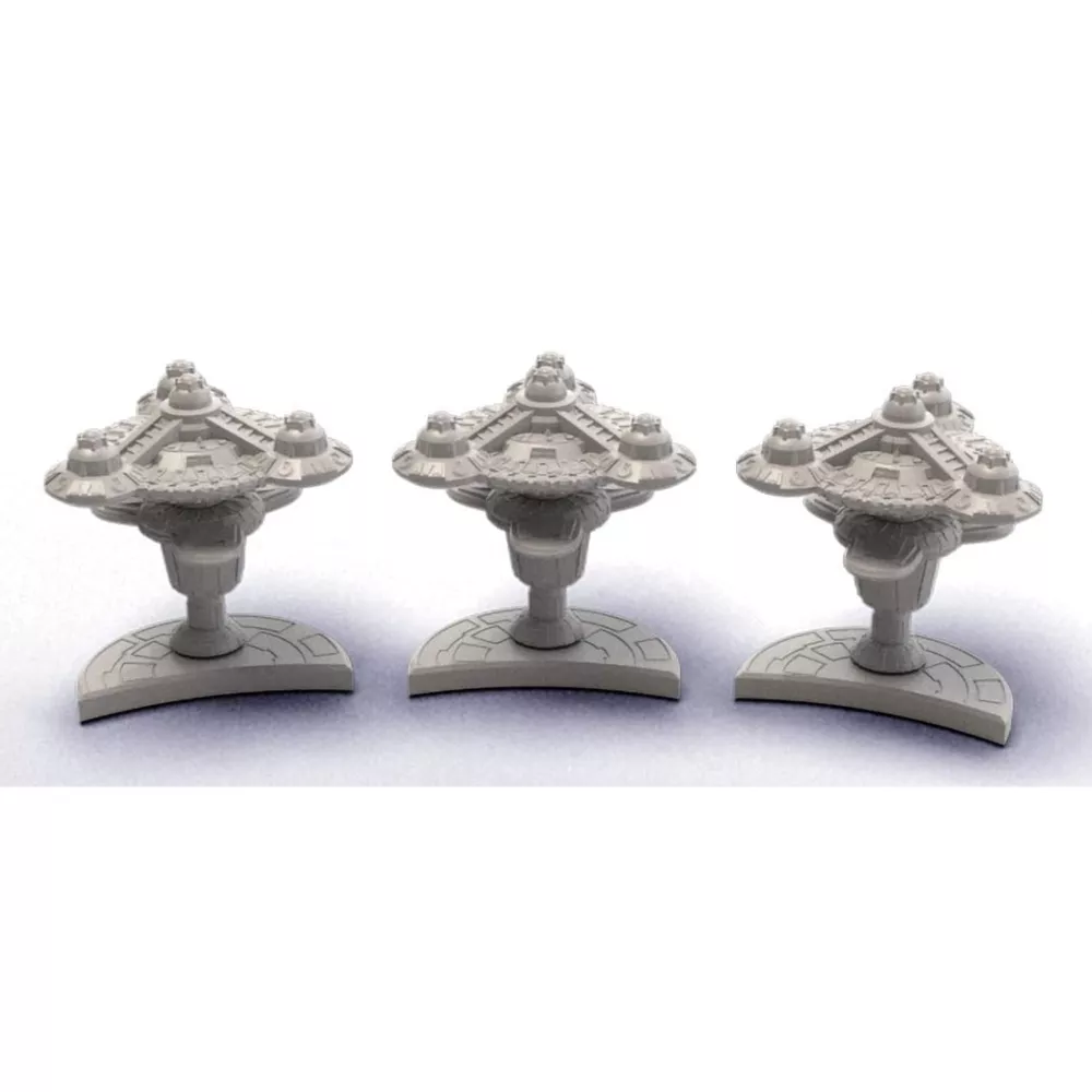 Three identical gray unpainted sci-fi miniature models, standing in a row on bases.