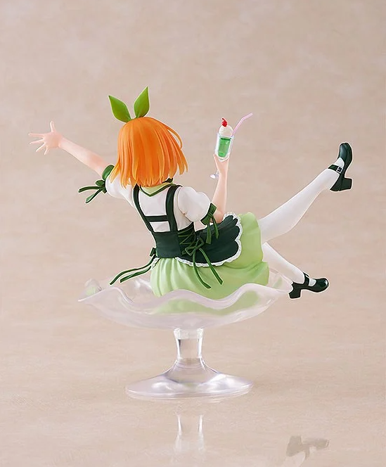 Back view of Yotsuba Nakano figure wearing a green and white dress and holding a milkshake sitting in a giant sundae dish