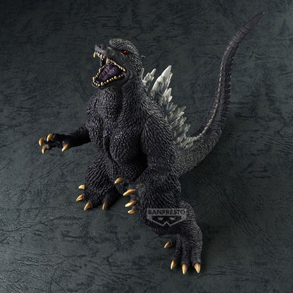 Black Godzilla action figure roaring, showing sharp teeth, white dorsal fins, and golden claws