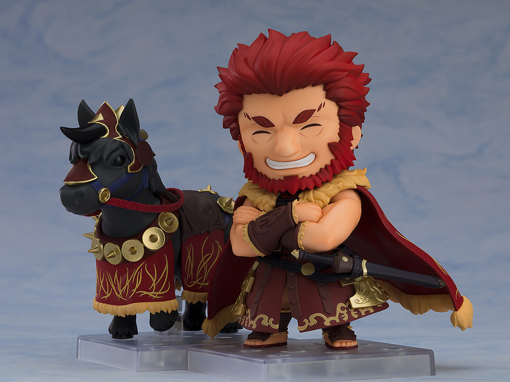 Nendoroid RiderIskandar DX Edition figure with red hair and beard wearing a red cloak and armor standing next to his black horse Bucephalus