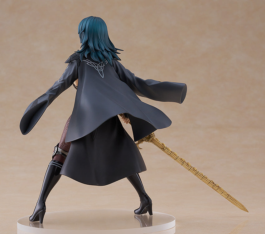 Fire Emblem Byleth female figure back view in a gray cloak with a white Celtic knot design holding a golden sword