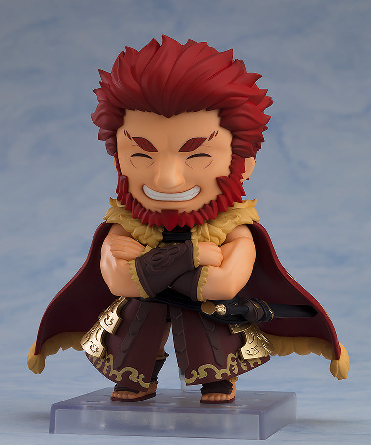 Good Smile Company Nendoroid Rider Iskanar figure from FateGrand Order This collectible features the character with red hair beard and a confident smile wearing a brown and gold outfit with a red