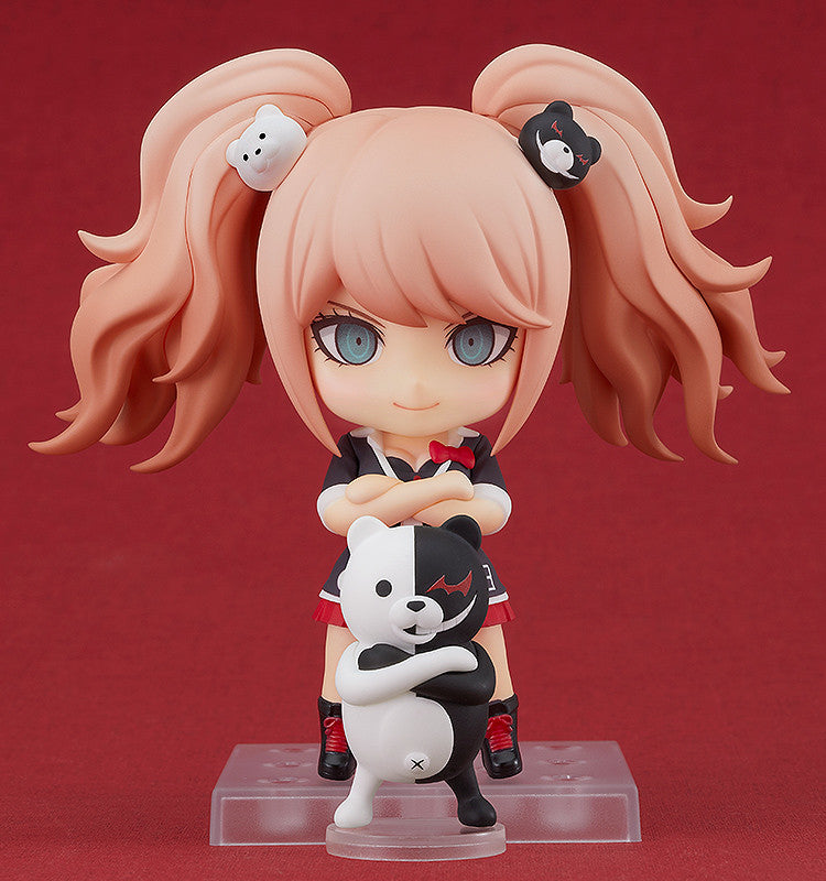 Danganronpa Nendoroid Junko Enoshima figure 20576 featuring blonde pigtails with white and black Monokuma hair clips holding a Monokuma plushie on a clear stand