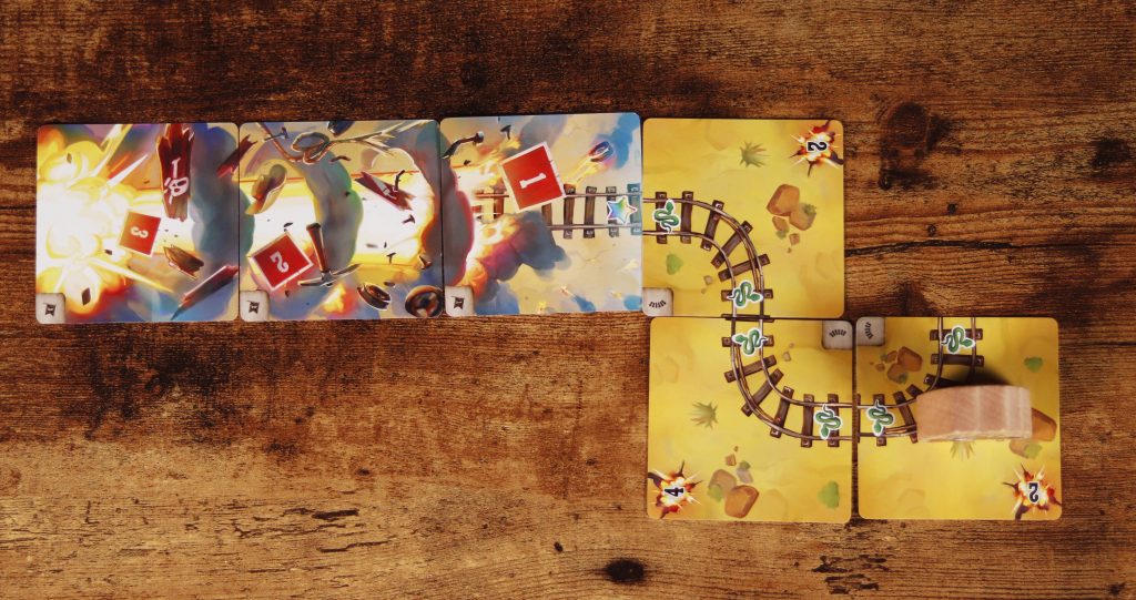 Players engaged in Infernal Wagon game, focusing on cards and player hands