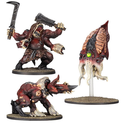Three detailed grotesque monster miniatures: a four-armed creature with weapons, a horned beast, and a floating tentacled brain