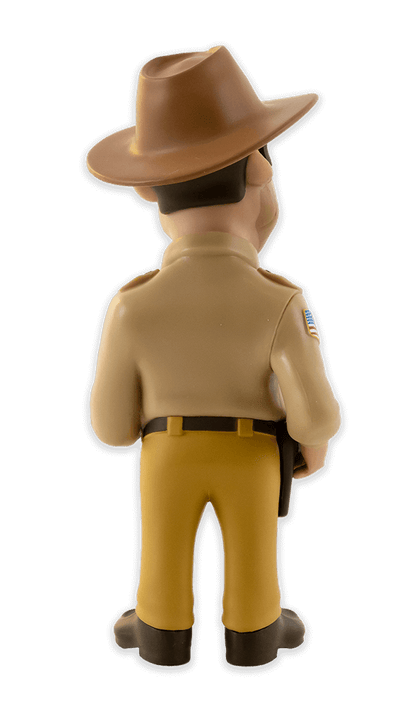 Back view of Minix Stranger Things Hopper vinyl figure in police uniform holding a white coffee mug with a name tag and badge detail