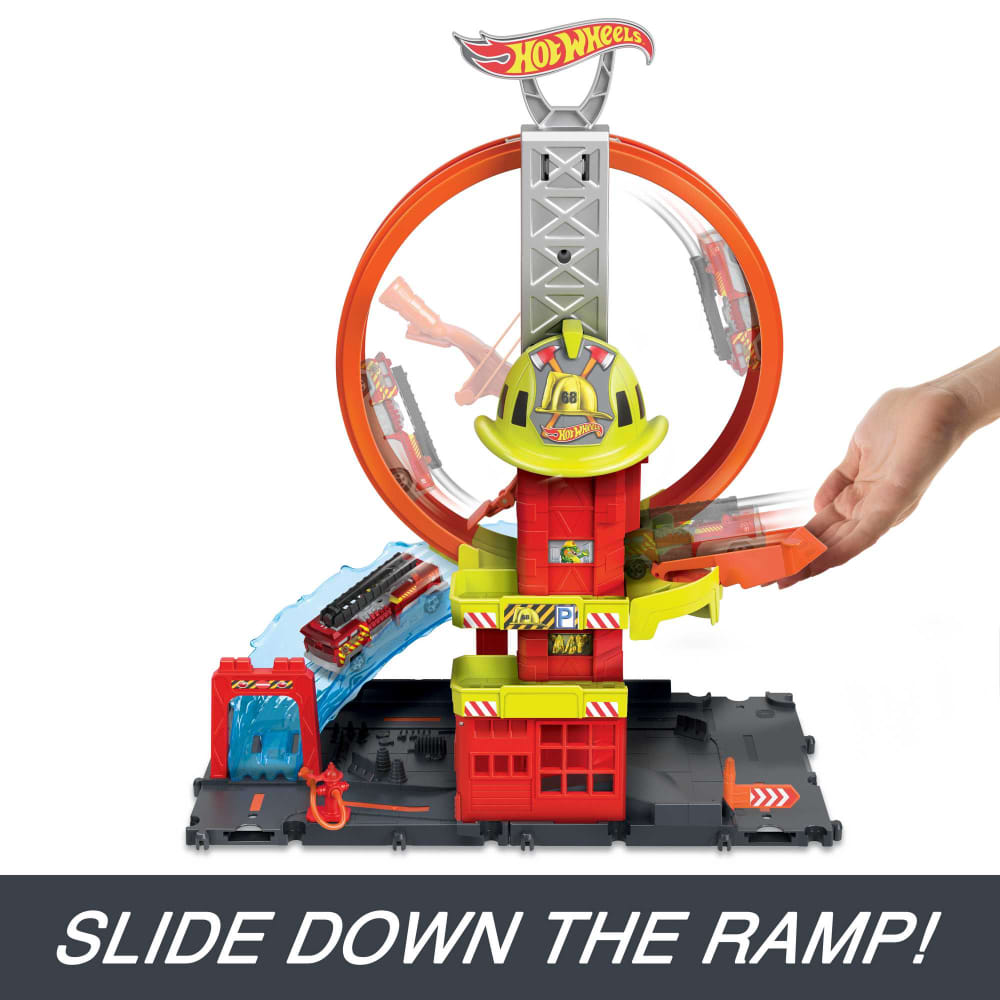 Hot Wheels City Super Loop Fire Station playset: Hand launches car into orange loop, another car on a water ramp