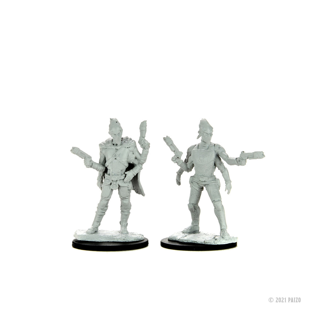 Two unpainted grey sci-fi multi-armed alien figures, each wielding multiple blaster pistols on bases