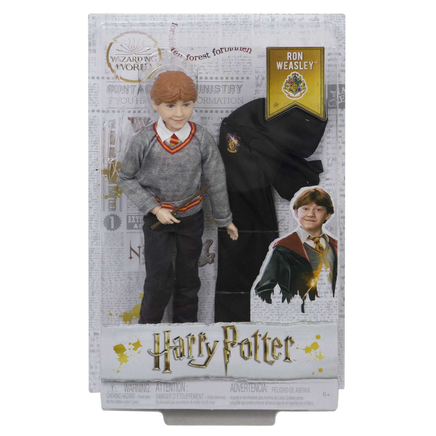 Ron Weasley doll in Harry Potter packaging, with red hair, grey sweater, holding a wand, and a black robe