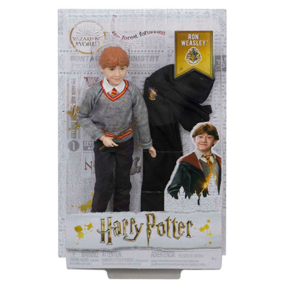 Ron Weasley doll in Harry Potter packaging, with red hair, grey sweater, holding a wand, and a black robe