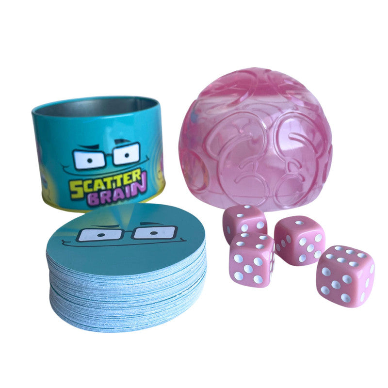 Scatter Brain game with pink plastic dome, dice, blue card stack, and tin